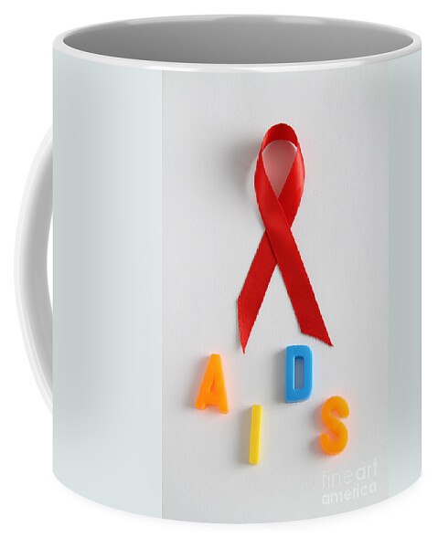 Acquired Immune Deficiency Coffee Mug featuring the photograph Aids Awareness Symbol #1 by Photo Researchers, Inc.