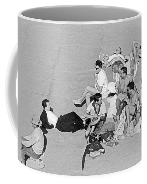 1953 Coffee Mug featuring the photograph Group Of Men Sunbathing #1 by Underwood Archives