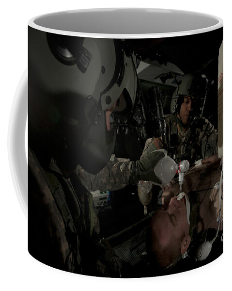 Army Coffee Mug featuring the photograph U.s. Army Medics Simulating Ventilation #1 by Terry Moore