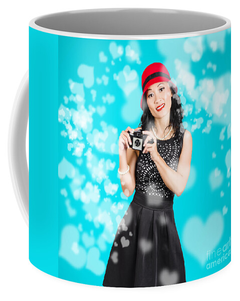 Camera Coffee Mug featuring the photograph Young woman holding retro camera on blue #1 by Jorgo Photography