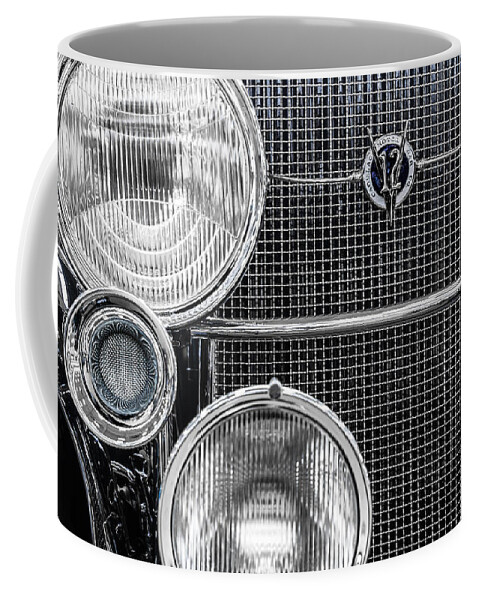 1935 Coffee Mug featuring the photograph 1935 Cadillac V12 Roadster Emblem and Headlights 1 by Ron Pate