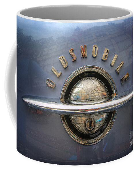 1952 Oldsmobile Logo Coffee Mug featuring the photograph 1952 Oldsmobile logo by Arttography LLC