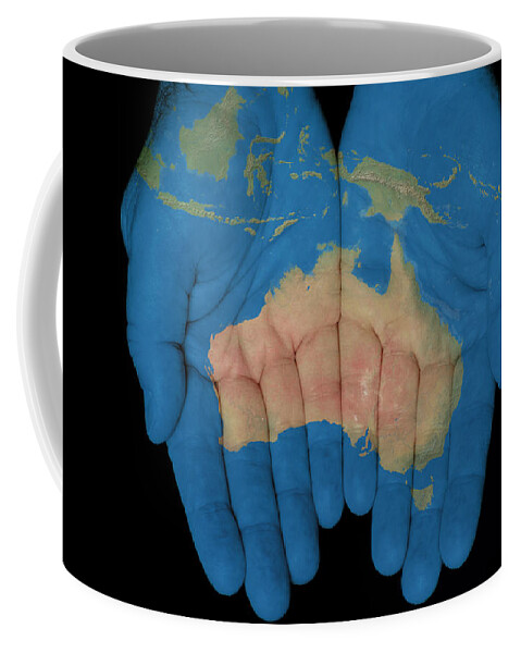 World Map Coffee Mug featuring the photograph Australia In Our Hands by Jim Vallee