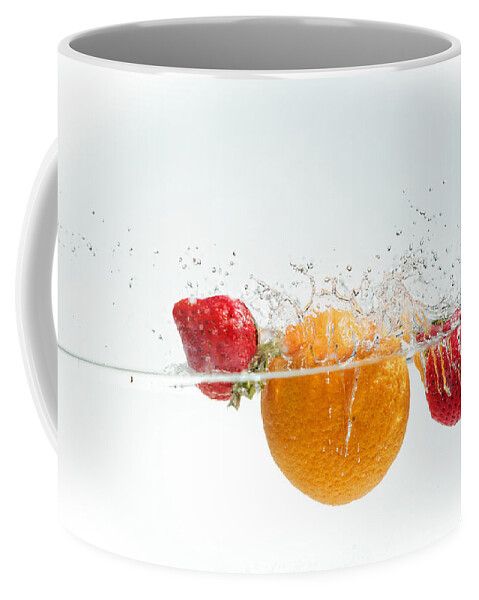 Aqua Coffee Mug featuring the photograph Splashing Fruits #5 by Peter Lakomy