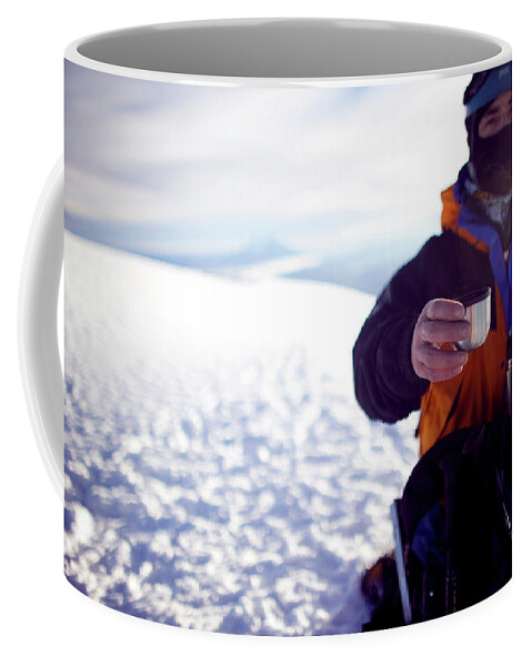 A Climber Offers Hot Tea From A Thermos Coffee Mug by Caroline