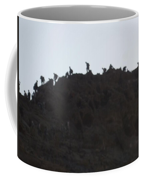 Mountain Coffee Mug featuring the photograph A Line of People Walking on a Mountain by Shea Holliman