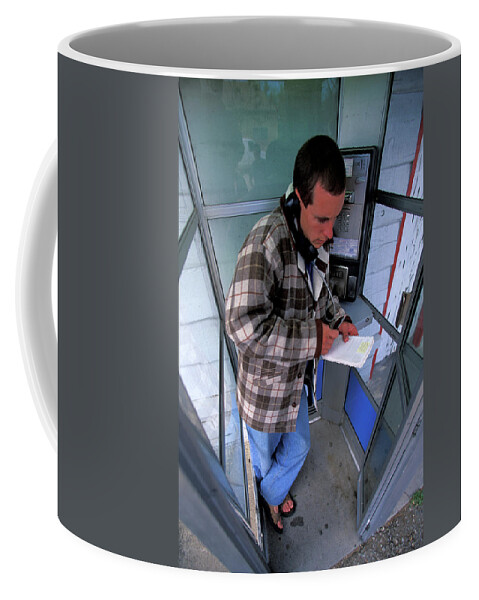 Adult Coffee Mug featuring the photograph A Man Uses A Pay Phone by Corey Rich