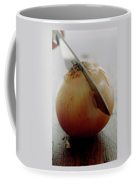 A Raw Onion Being Cut In Half Coffee Mug