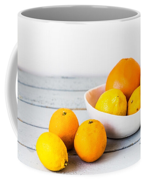 Citrus Fruit Coffee Mug featuring the photograph Assorted Citrus Fruits by Philippe Garo