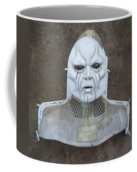 Mask Coffee Mug featuring the sculpture Atomic Energy Survivor by Douglas Fromm