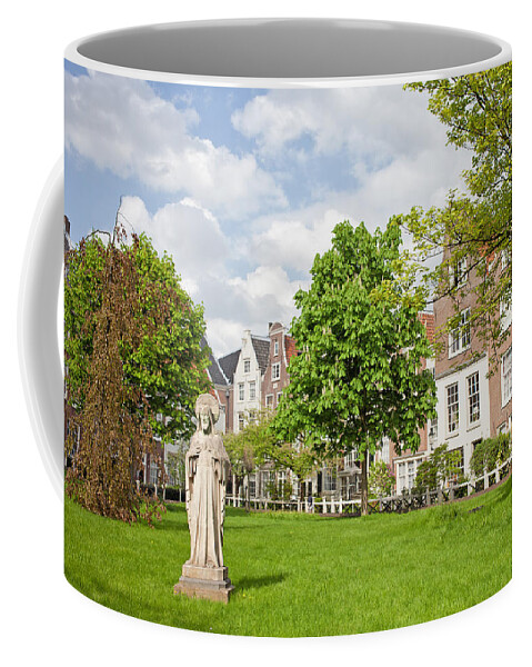 Amsterdam Coffee Mug featuring the photograph Begijnhof Courtyard in Amsterdam by Artur Bogacki