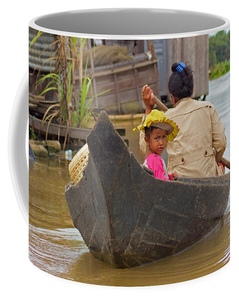 Cambodia Coffee Mug featuring the photograph Boat on the river by David Freuthal