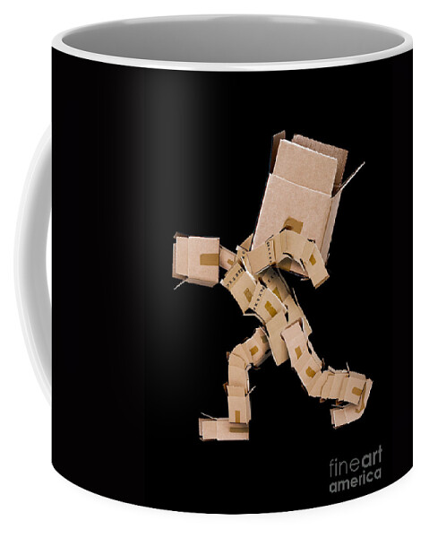 Strength Coffee Mug featuring the photograph Box character carrying large box by Simon Bratt