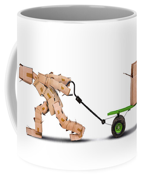 Box Coffee Mug featuring the photograph Box character pulling box on trolley by Simon Bratt