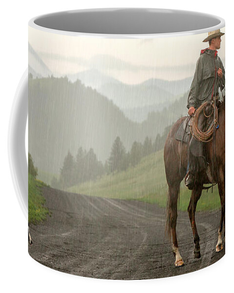 Cowboy Coffee Mug featuring the photograph Braving the Rain by Todd Klassy