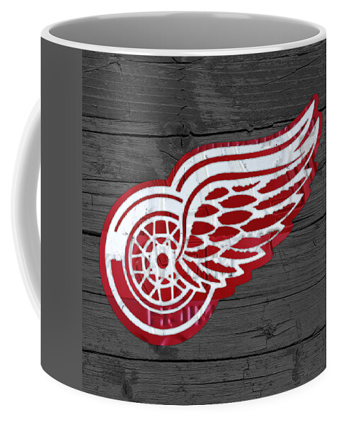 Detroit Coffee Mug featuring the mixed media Detroit Red Wings Recycled Vintage Michigan License Plate Fan Art on Distressed Wood by Design Turnpike