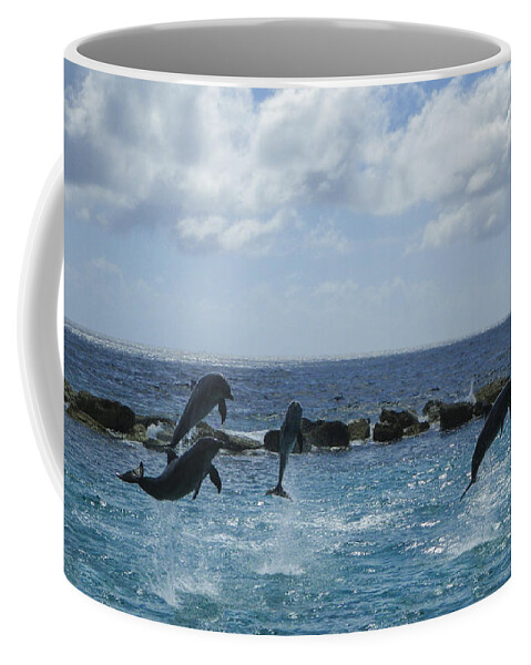 Dolphins Coffee Mug featuring the photograph Dolphin Fun by Louise Magno