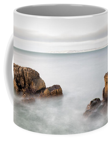 Pans Rock Coffee Mug featuring the photograph Ballycastle - Face in the Rock by Nigel R Bell