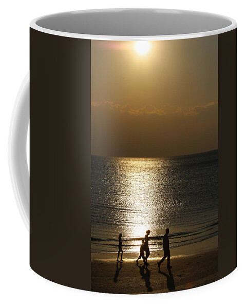 Sunset Coffee Mug featuring the photograph Family Sunset Jog by Dart Humeston