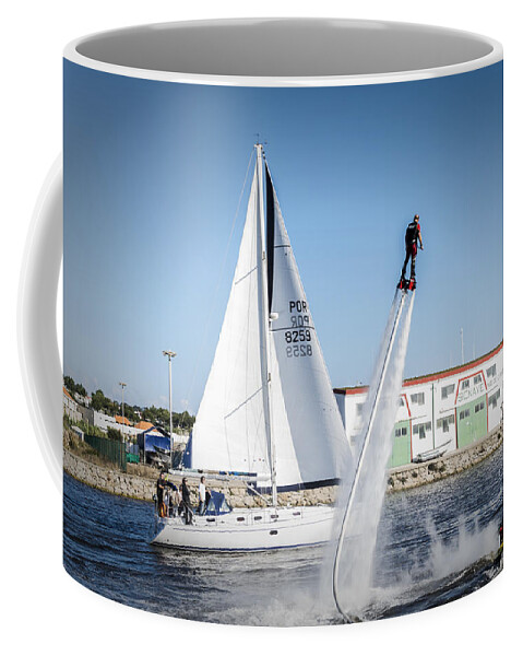 Action Coffee Mug featuring the photograph Flying in the water by Paulo Goncalves