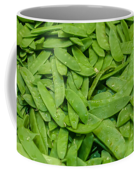Agriculture Coffee Mug featuring the photograph Freshly harvested peas on display at the farmers market by Alex Grichenko