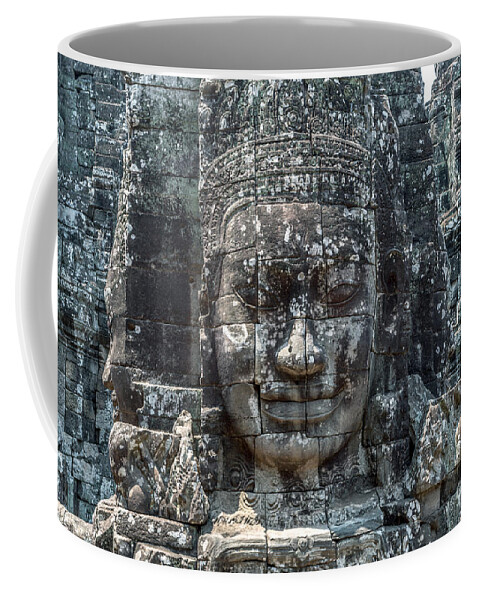 Buddha Coffee Mug featuring the photograph Giant Buddha face inside Bayon temple - Angkor Wat - Cambodia by Matteo Colombo