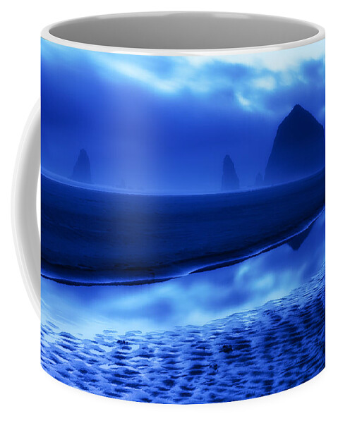 Haystack Rock Needles Cannon Beach Oregon Or Ocean Landscape Seascape Moody Blue Reflection Sand Fog Clouds Sunset Coffee Mug featuring the photograph Haystack Blues by Patrick Campbell