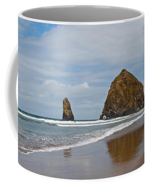 Beach Coffee Mug featuring the photograph Haystack Rock Reflected in the Wet Sand by Jeff Goulden