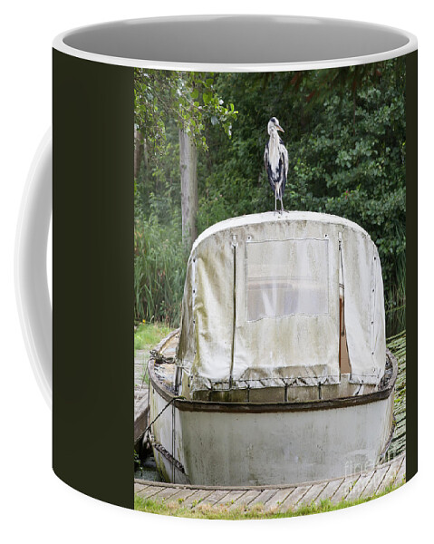 Heron Coffee Mug featuring the photograph Heron perched on boat by Simon Bratt