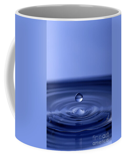 Water Drop Coffee Mug featuring the photograph Hovering Blue Water Drop by Anthony Sacco