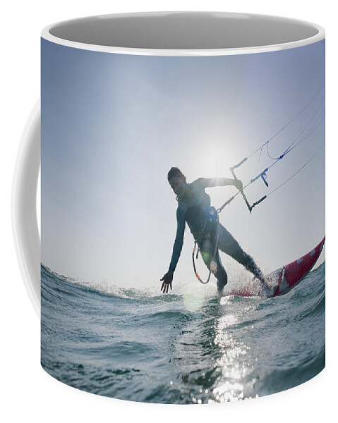 Horizon Coffee Mug featuring the photograph Kitesurfer Illuminated By The Sunlight by Ben Welsh