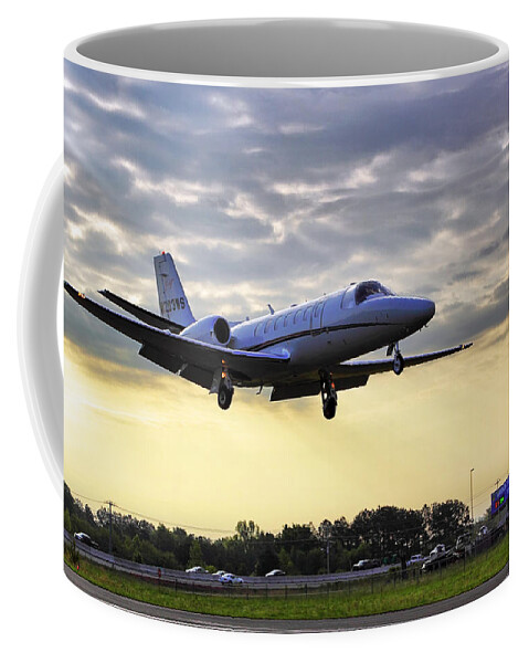 Airplane Coffee Mug featuring the photograph Landing at Sunrise by Jason Politte