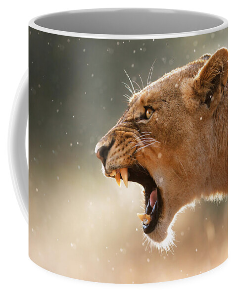 #faatoppicks Coffee Mug featuring the photograph Lioness displaying dangerous teeth in a rainstorm by Johan Swanepoel