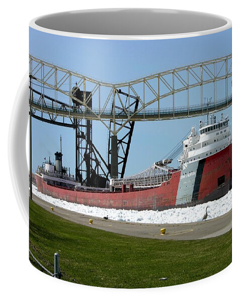 Great Lakes Coffee Mug featuring the photograph Moving through the ice to the Soo Locks by Keith Stokes