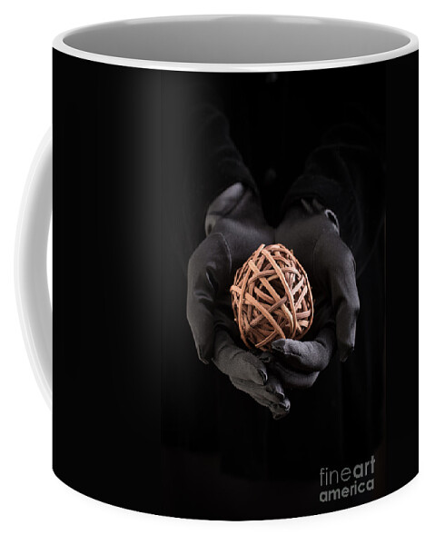 Book Coffee Mug featuring the photograph Mystical hands holding a woven ball by Edward Fielding