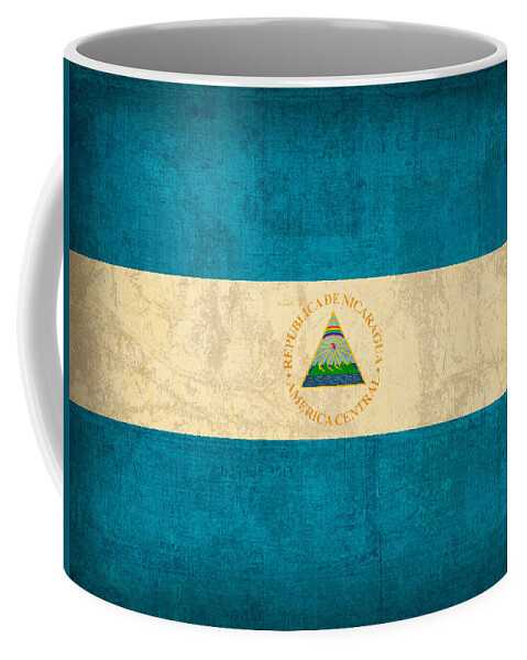 Nicaragua Coffee Mug featuring the mixed media Nicaragua Flag Vintage Distressed Finish by Design Turnpike