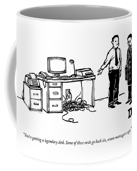 One Employee Shows Another A Desk Coffee Mug