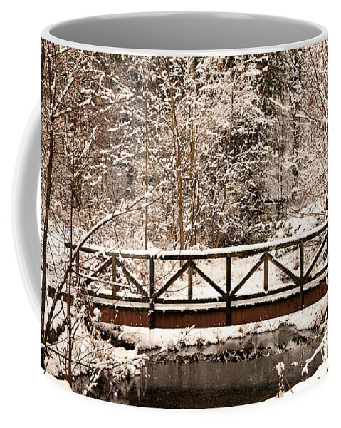 Winter Coffee Mug featuring the photograph Pedestrian bridge in the snow by Michael Porchik