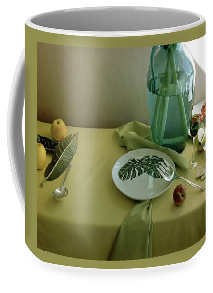 Plates, Apples And A Vase On A Green Tablecloth Coffee Mug