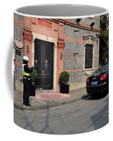 Policeman Coffee Mug featuring the photograph Policeman issues parking ticket Shanghai China by Imran Ahmed