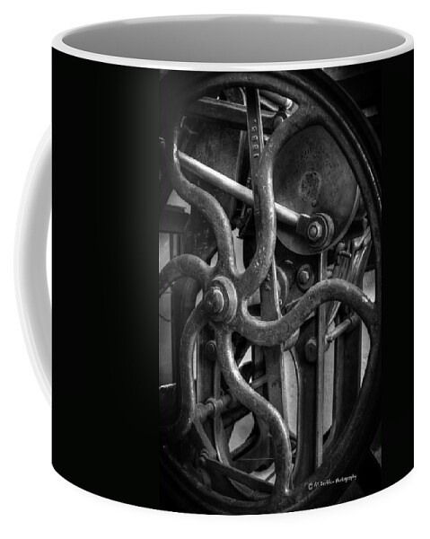 Platen Press Coffee Mug featuring the photograph Printing Press Flywheel by Al Griffin