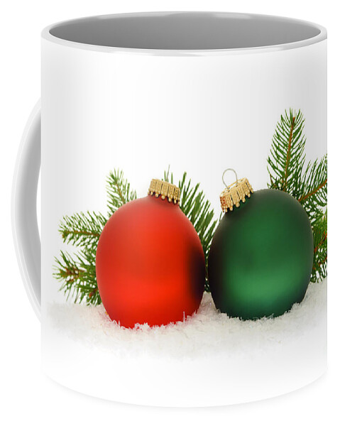 Christmas Coffee Mug featuring the photograph Red and green Christmas baubles by Elena Elisseeva