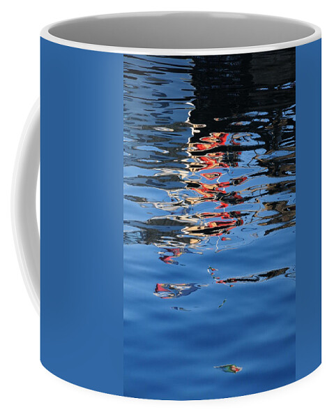 Water Reflections Red Coffee Mug featuring the photograph Reflections in red by Susie Rieple
