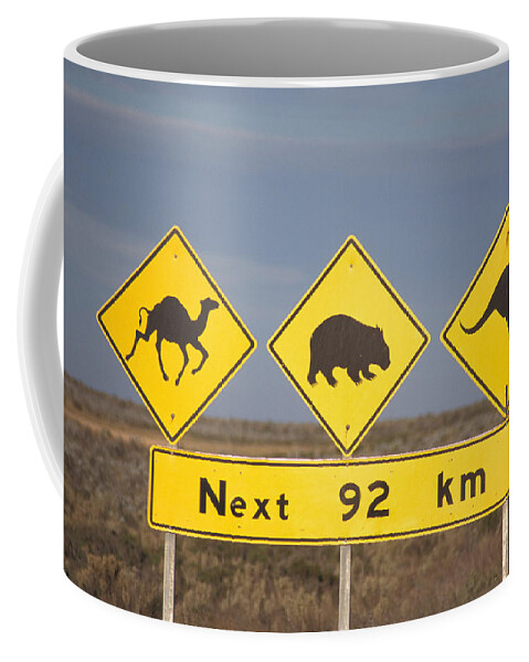 Flpa Coffee Mug featuring the photograph Road Sign Nullarbor Plain Australia by Mark Newman