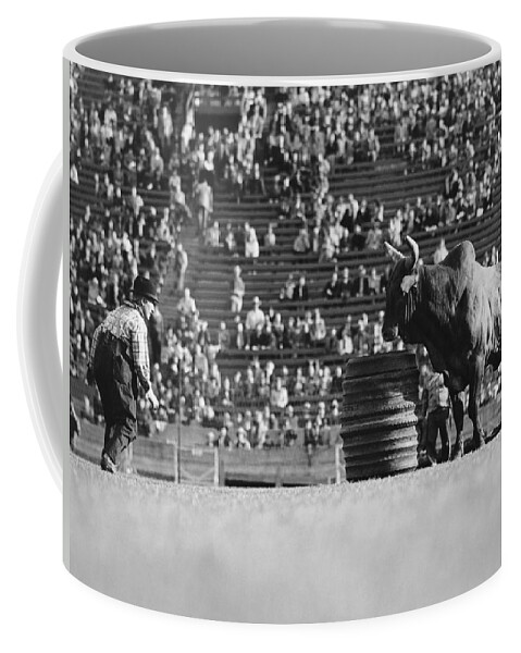 1920s Coffee Mug featuring the photograph Rodeo Clown Watches Bull by Otto Rothschild