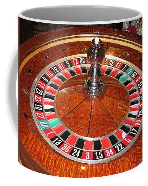Casino Coffee Mug featuring the photograph Roulette wheel and chips by Tom Conway