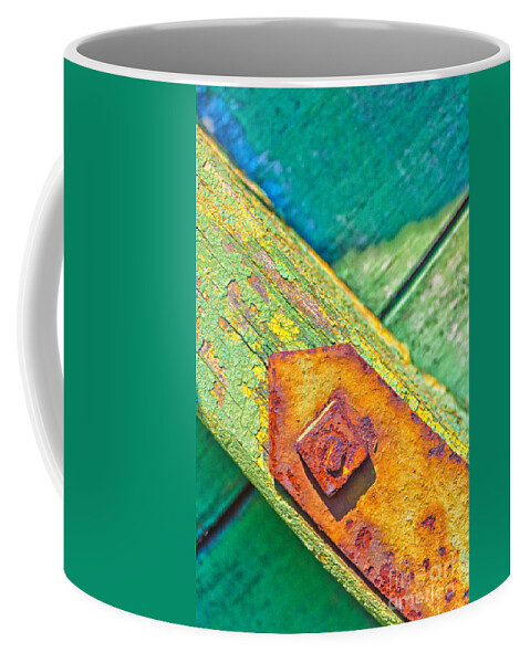 Abstract Coffee Mug featuring the photograph Rusty bolt on rotten green wood by Silvia Ganora