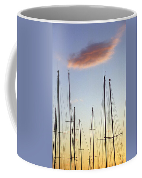 Sailboat Masts Coffee Mug featuring the photograph A Forest of Sailboat Masts Silhouetted by a setting Sun by John Harmon