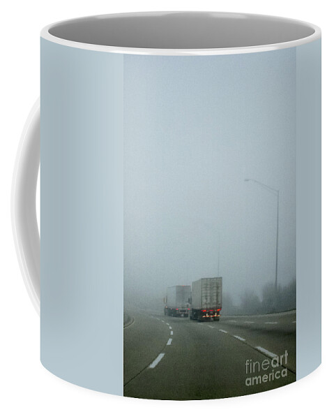 Road; Roadway; Highway; Interstate; Lanes; Day; Daytime; Lines; Fog; Foggy; Black; Asphalt; Cement; Shroud; Truck; Semi; Trailer; Transportation; Transport; Two; Back; Taillights; Lights; Curve; Bend; Street Lights Coffee Mug featuring the photograph Semis by Margie Hurwich