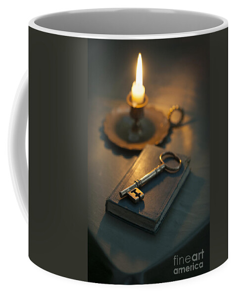 Bible Coffee Mug featuring the photograph Single Golden Key On A Book By Candle Light by Lee Avison
